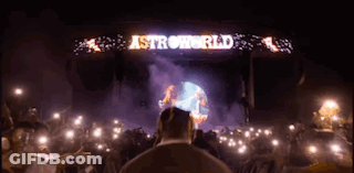 A Man Stands In Front Of A Stage That Says Astroworld On It GIF