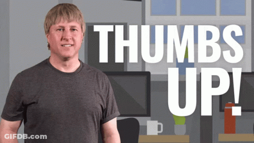 A Man Stands In Front Of A Thumbs Up Sign GIF