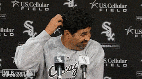 A Man Stands In Front Of A U.s. Cellular Field Background GIF