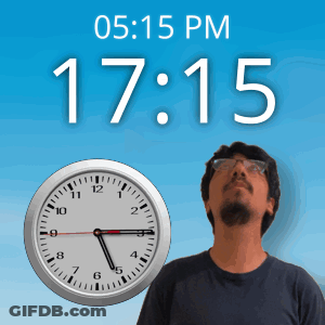 A Man Stands In Front Of A Wall Clock That Says 15:15 Pm GIF