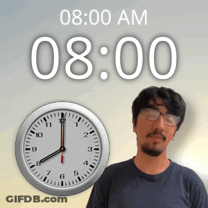 A Man Stands In Front Of A Wall Clock That Says 8:00 Am GIF