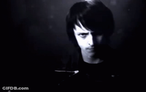 A Man Stands In Front Of A Wall Of Numbers GIF