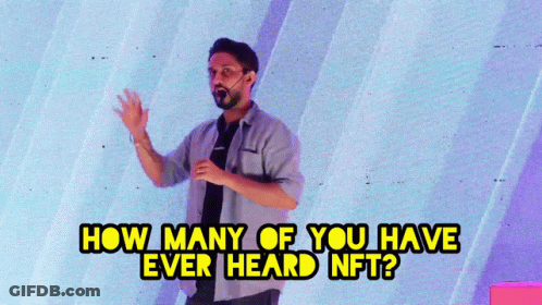 A Man Stands In Front Of A Wall With The Words " How Many Of You Have Ever Heard Nft " Above Him GIF