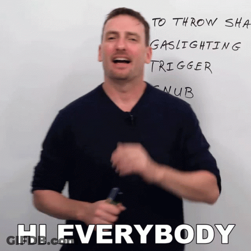 A Man Stands In Front Of A White Board That Says Hi Everybody On It GIF