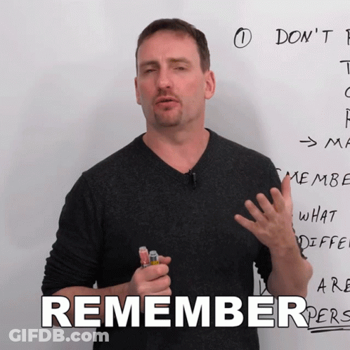 A Man Stands In Front Of A White Board With The Word Remember On It GIF