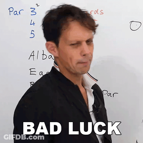 A Man Stands In Front Of A White Board With The Words " Bad Luck " On It GIF