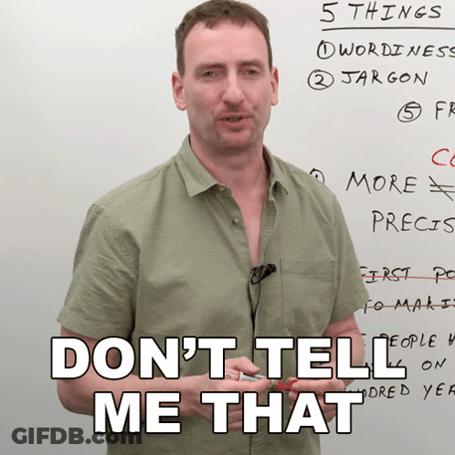 A Man Stands In Front Of A White Board With The Words " Do N't Tell Me That " GIF