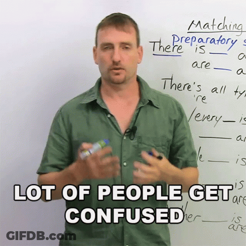 A Man Stands In Front Of A White Board With The Words " Lot Of People Get Confused " GIF
