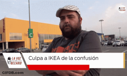 A Man Stands In Front Of A Yellow Building With The Words Culpa A Ikea De La Confusion On The Bottom GIF