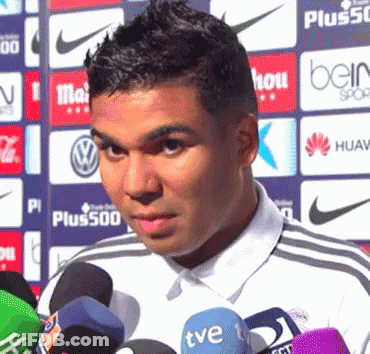 A Man Stands In Front Of Several Microphones Including A Tve One GIF