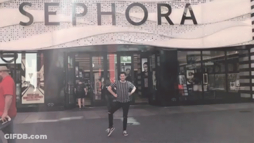 A Man Stands In Front Of The Sephora Store GIF
