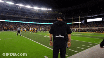A Man Stands On A Football Field Wearing A Shirt That Says San Francisco On The Back GIF