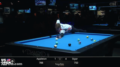 A Man Stands On A Pool Table In Front Of A Screen That Says Us Open On It GIF