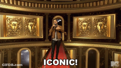 A Man Stands On A Red Carpet With The Word Iconic Written On The Bottom GIF