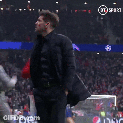 A Man Stands On A Soccer Field In Front Of A Bt Sport Banner GIF