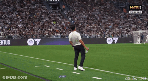 A Man Stands On A Soccer Field With A Banner That Says Il Club E Tuo GIF