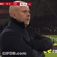 A Man Stands On A Soccer Field With A Scoreboard Behind Him That Says Liv GIF