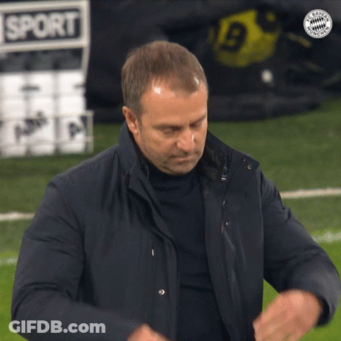 A Man Stands On A Soccer Field With A Sign That Says Sport On It GIF