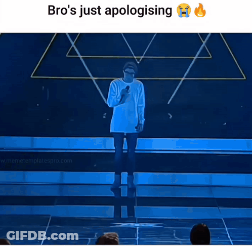 A Man Stands On A Stage With A Microphone And Says Bro 'S Just Apologizing GIF