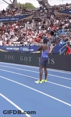 A Man Stands On A Track In Front Of A Sign That Says ' You Got This ' GIF
