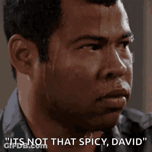A Man Sweating With The Words " It 'S Not That Spicy David " On The Bottom GIF