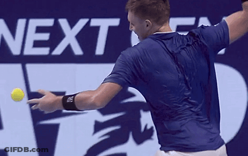 A Man Swings A Tennis Racket In Front Of A Next Atp Finals Sign GIF