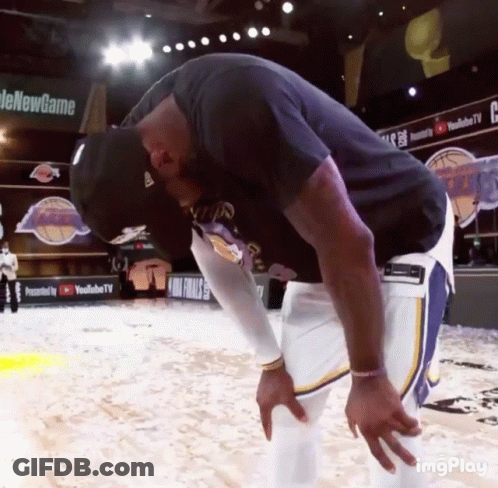 A Man Taking A Break On A Basketball Court With A Youtube Tv Banner In The Background GIF
