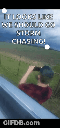 A Man Taking A Picture Of A Storm With A Caption That Says " It Looks Like We Should Go Storm Chasing ! " GIF