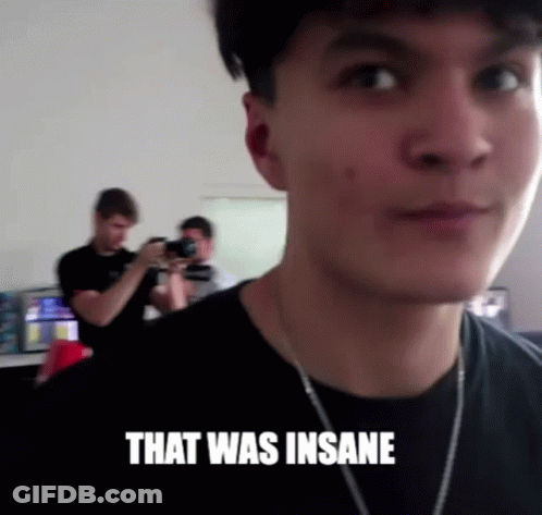 A Man Taking A Picture Of Another Man With The Words That Was Insane Above Him GIF