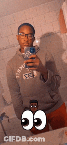 A Man Taking A Picture Of Himself In A Mirror Wearing A Hoodie That Says Abercrombie & Fitch GIF