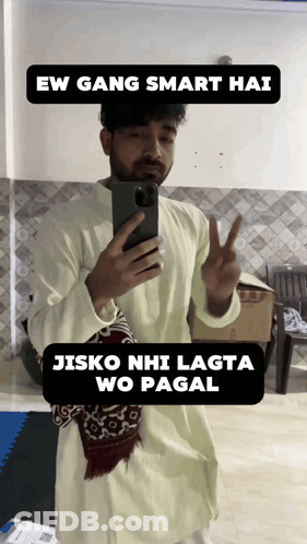 A Man Taking A Picture Of Himself With A Caption That Says " Ew Gang Smart Hai Jisko Nhi Lagta Wo Pagal " GIF