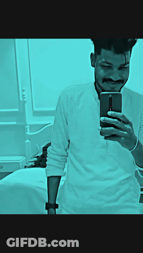 A Man Taking A Picture Of Himself With Wah Wah Ji Wah Written Above Him GIF