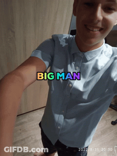 A Man Taking A Selfie With The Words Big Man Written On His Shirt GIF