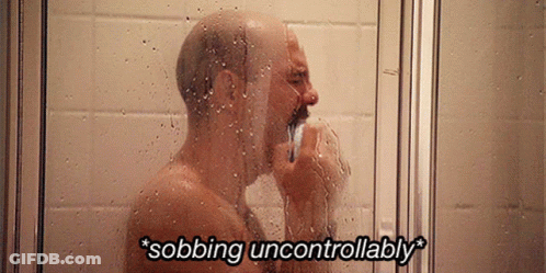 A Man Taking A Shower With The Words " Sobbing Uncontrollably " Written Above Him GIF