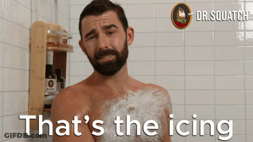 A Man Taking A Shower With The Words That 'S The Icing Behind Him GIF