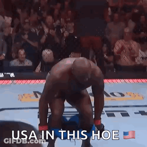 A Man Taking Off His Pants In A Boxing Ring With The Caption Usa In This Hoe GIF