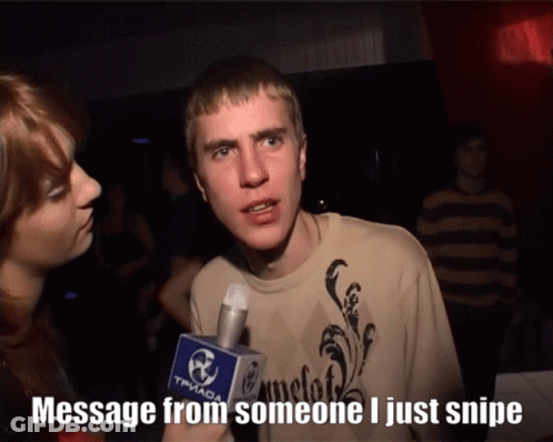 A Man Talking Into A Microphone That Says " Message From Someone I Just Snipe " On It GIF