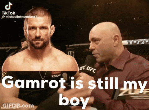 A Man Talking Into A Microphone With The Words Gamrot Is Still My Boy Below Him GIF