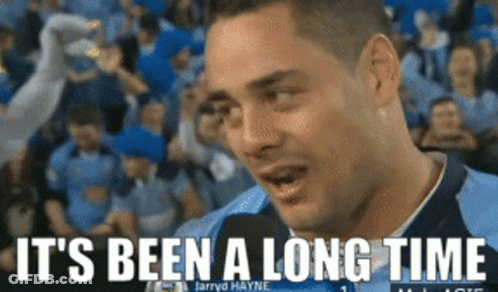 A Man Talking Into A Microphone With The Words " It 'S Been A Long Time " Below Him GIF