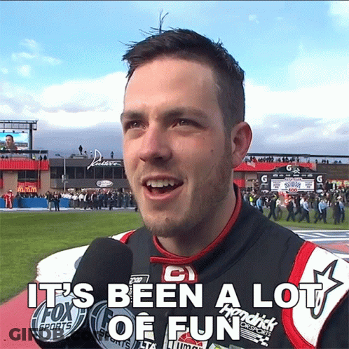 A Man Talking Into A Microphone With The Words It 'S Been A Lot Of Fun Above Him GIF