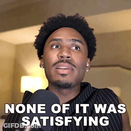 A Man Talking Into A Microphone With The Words None Of It Was Satisfying Below Him GIF