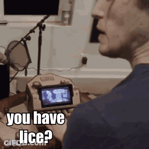 A Man Talking Into A Microphone With The Words " You Have Lice " On The Screen GIF