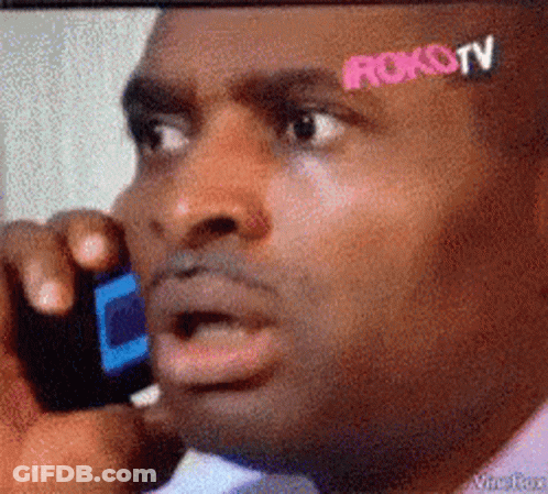 Man Talking On Cell Phone With Roku TV Sticker GIF