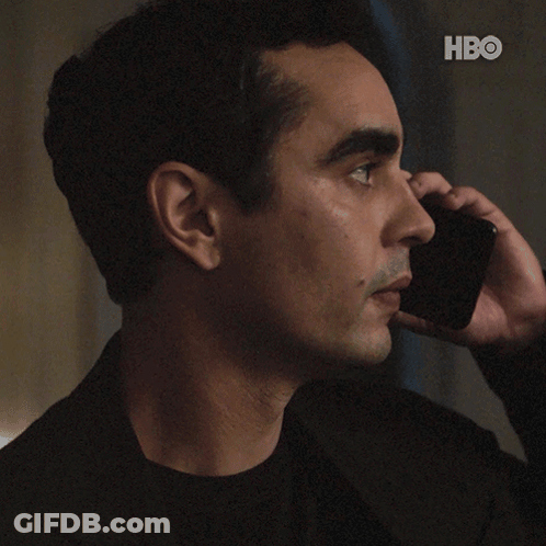 A Man Talking On A Cell Phone With The Words " Do N't Do Anything " GIF