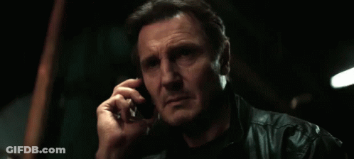 A Man Talking On A Cell Phone With The Words " Good Luck " Below Him GIF