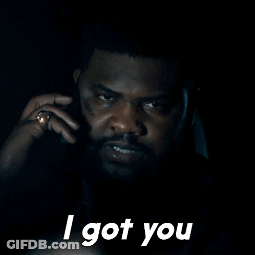 A Man Talking On A Cell Phone With The Words " I Got You " Above Him GIF