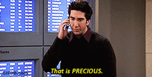 A Man Talking On A Cell Phone With The Words That Is Precious Written Below Him GIF