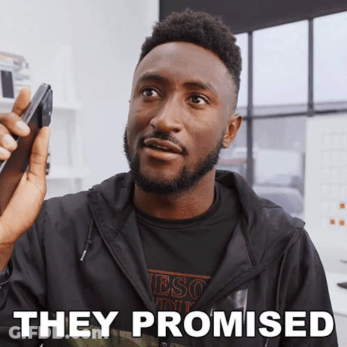 A Man Talking On A Cell Phone With The Words " They Promised " Above Him GIF