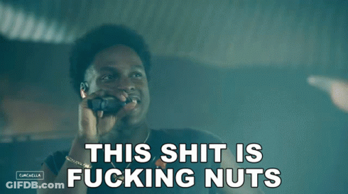 A Man Talking On A Cell Phone With The Words " This Shit Is Fucking Nuts " Above Him GIF
