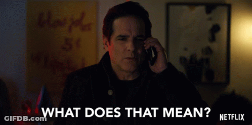 A Man Talking On A Cell Phone With The Words " What Does That Mean " Written On The Bottom GIF